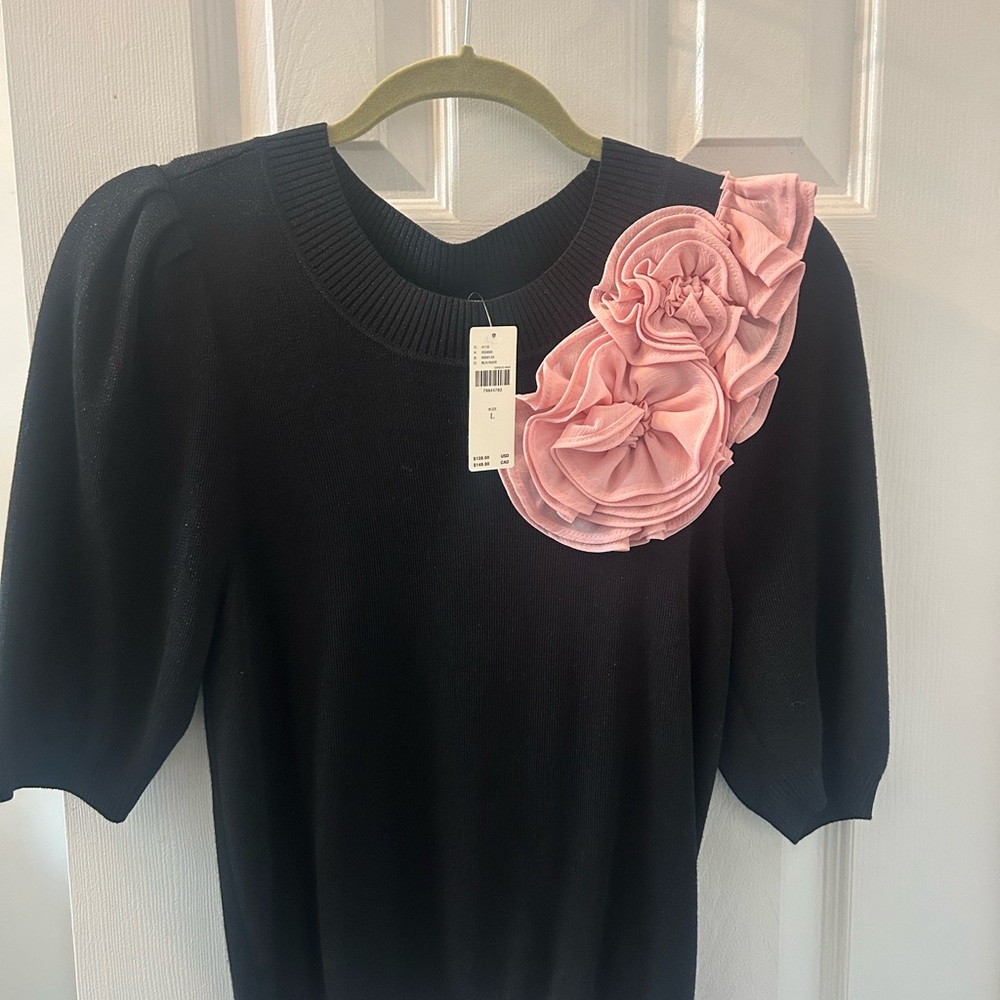 Chic Black Sweater with Pink Floral Accent